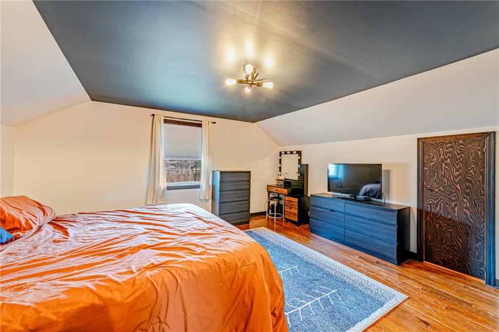 481 Crawford Run Road Cheswick, PA 15024 - Photo 18 of 24 a bedroom with a bed dresser and a flat tv screen