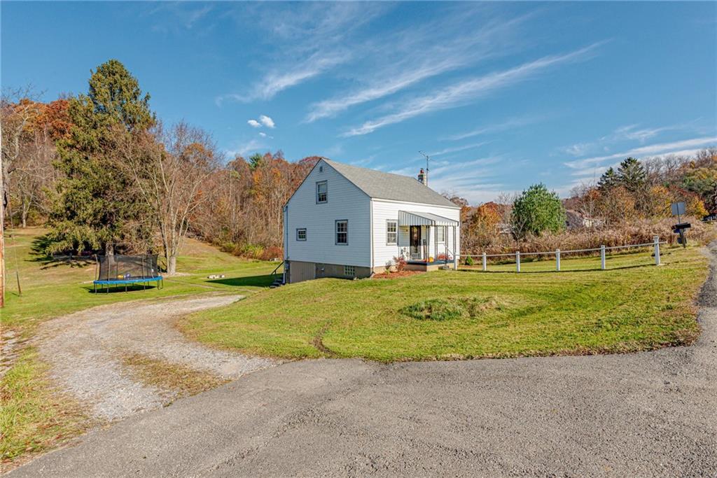 481 Crawford Run Road Cheswick, PA 15024 - Photo 20 of 24 a front view of a house with a yard