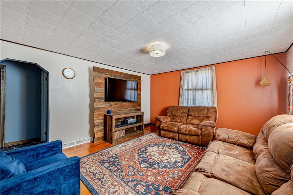 481 Crawford Run Road Cheswick, PA 15024 - Photo 4 of 24 a living room with furniture and a flat screen tv