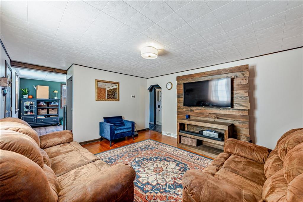 481 Crawford Run Road Cheswick, PA 15024 - Photo 6 of 24 a living room with furniture and a flat screen tv