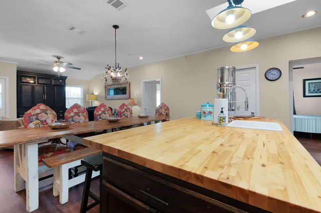 a kitchen with stainless steel appliances a stove a microwave and cabinets