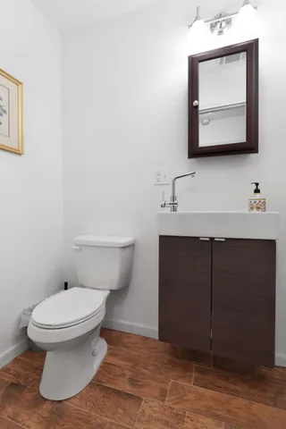 a bathroom with a bathtub sink vanity and mirror