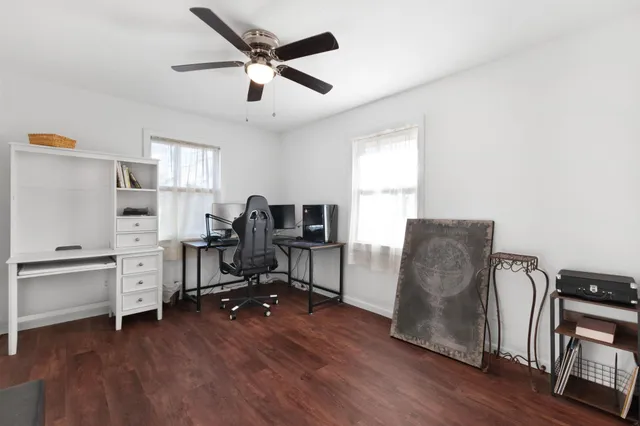 a room with a walk in closet and wooden floor