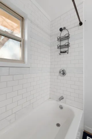 a view of a house with a snow on the road