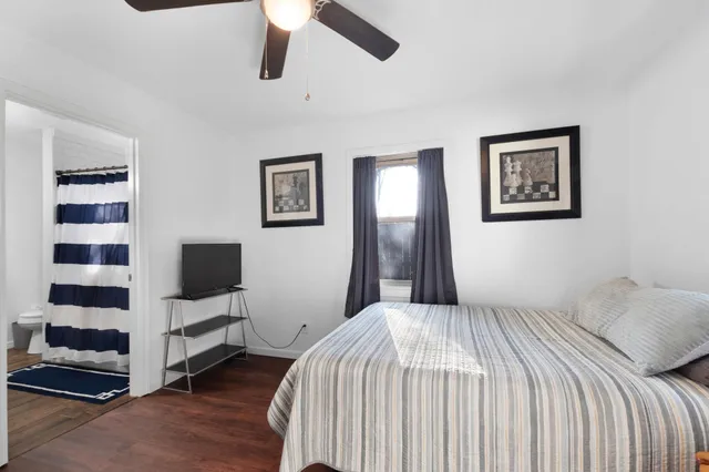 a living room with furniture a rug and a window