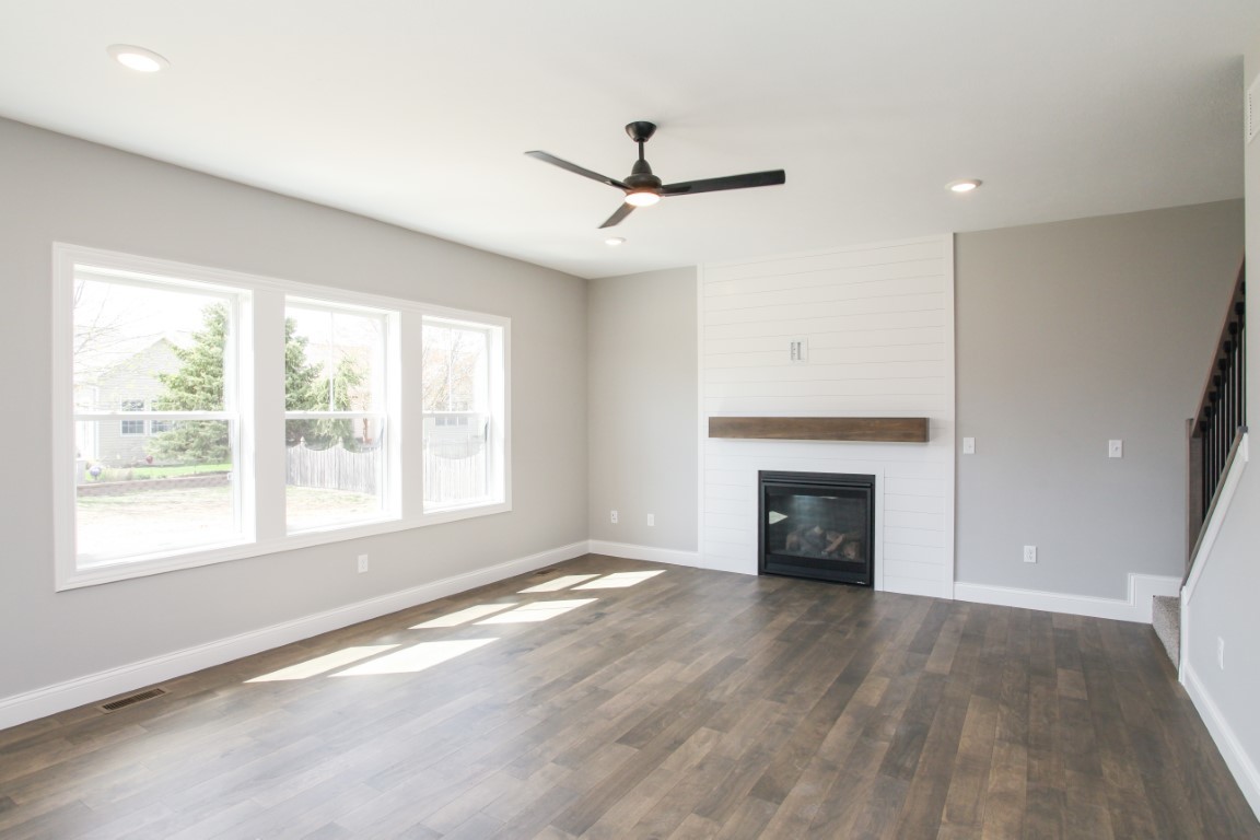 9 Brookstone Circle Bloomington, IL 61704 - Photo 12 of 40 a view of an empty room with a window and fireplace