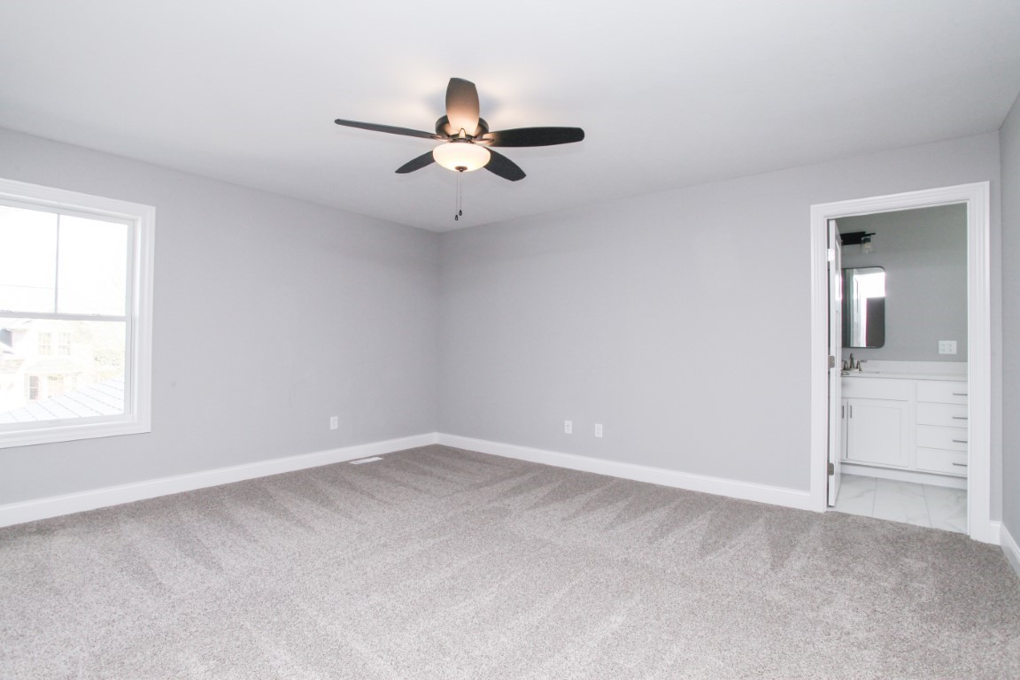 9 Brookstone Circle Bloomington, IL 61704 - Photo 23 of 40 an empty room with windows and fan