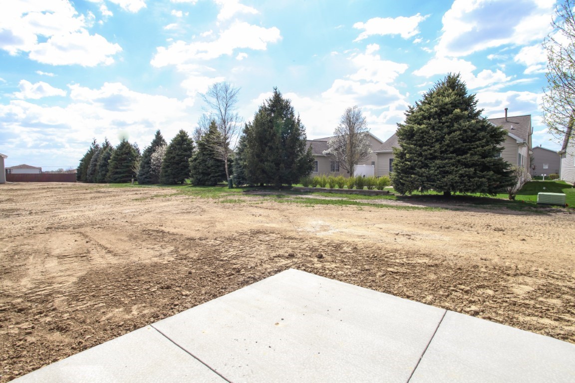 9 Brookstone Circle Bloomington, IL 61704 - Photo 38 of 40 a view of a yard with an trees