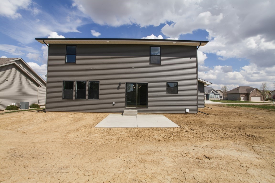 9 Brookstone Circle Bloomington, IL 61704 - Photo 39 of 40 a front view of a house with a yard and garage