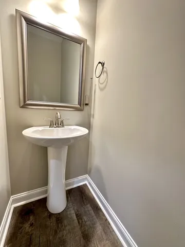 a bathroom with a sink and mirror