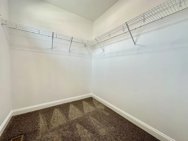 a view of a room with racks on the wall