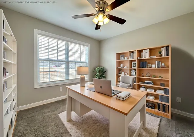 a workspace with furniture and a bookshelf
