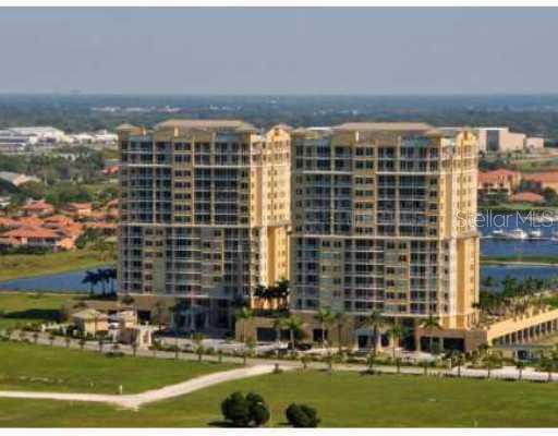 130 Riviera Dunes Way, Unit 705 Palmetto, FL 34221 - Photo 1 of 1 a front view of building with outdoor space