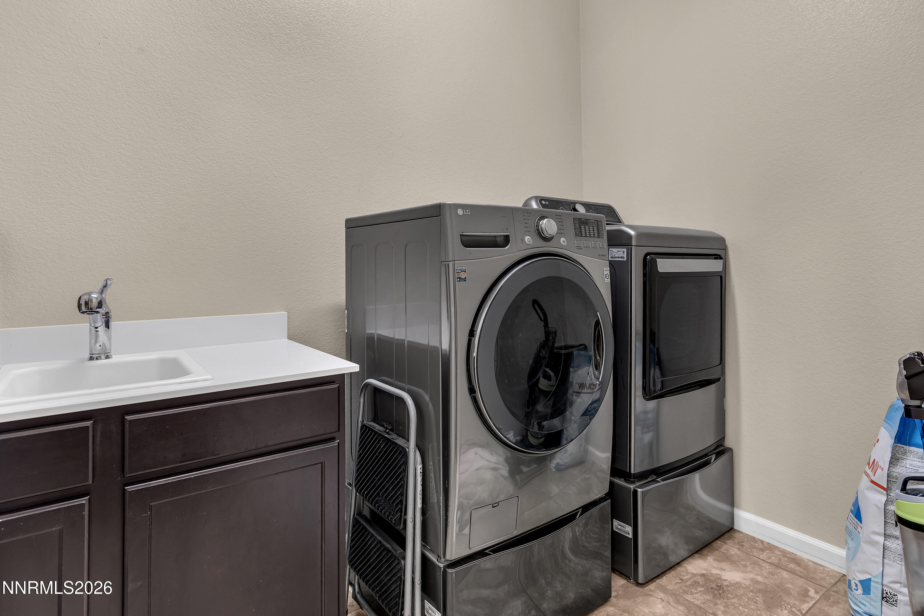 9021 Iron Sky Court Reno, NV 89523 - Photo 30 of 39 a utility room with dryer and washer