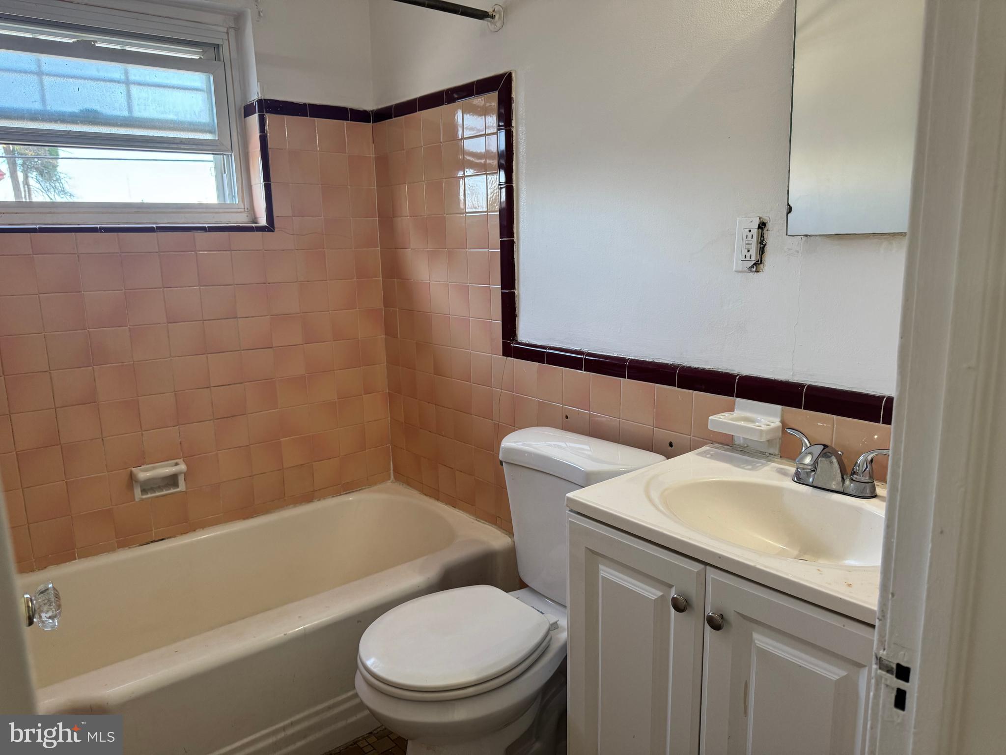 7736 Gilbert Street Philadelphia, PA 19150 - Photo 5 of 13 a bathroom with a sink toilet and shower