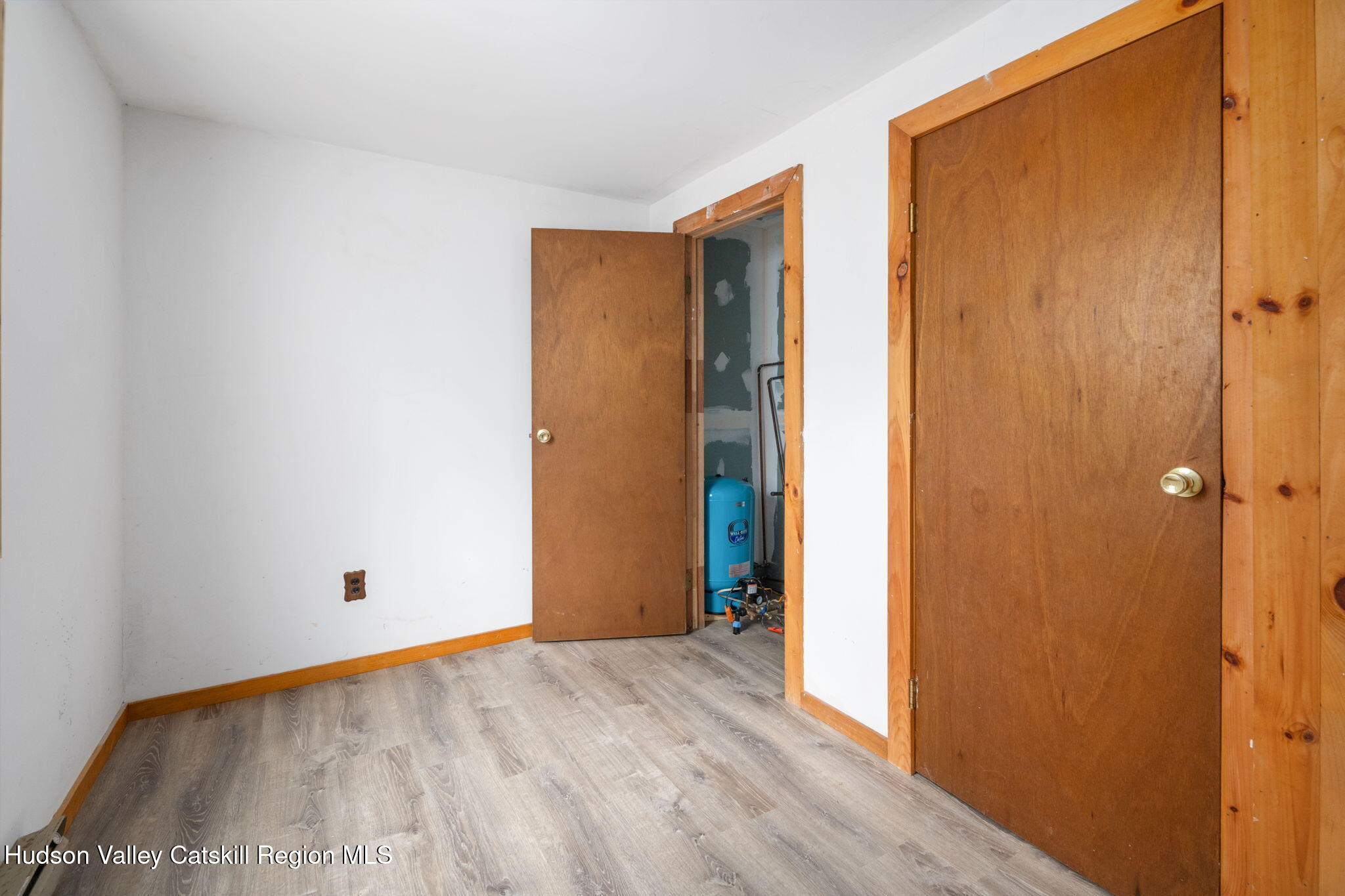 202 Blakesley Road, Unit PRIVATE Gilboa, NY 12076 - Photo 19 of 39 a view of an empty room with wooden floor