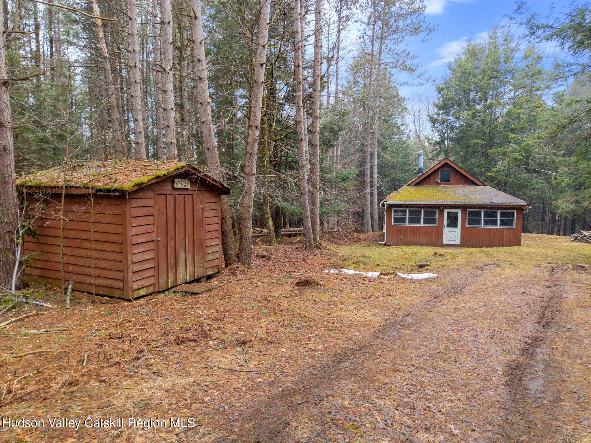 202 Blakesley Road, Unit PRIVATE Gilboa, NY 12076 - Photo 2 of 39 a front view of a house with garden