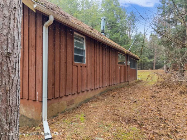 a view of a house with wooden fence