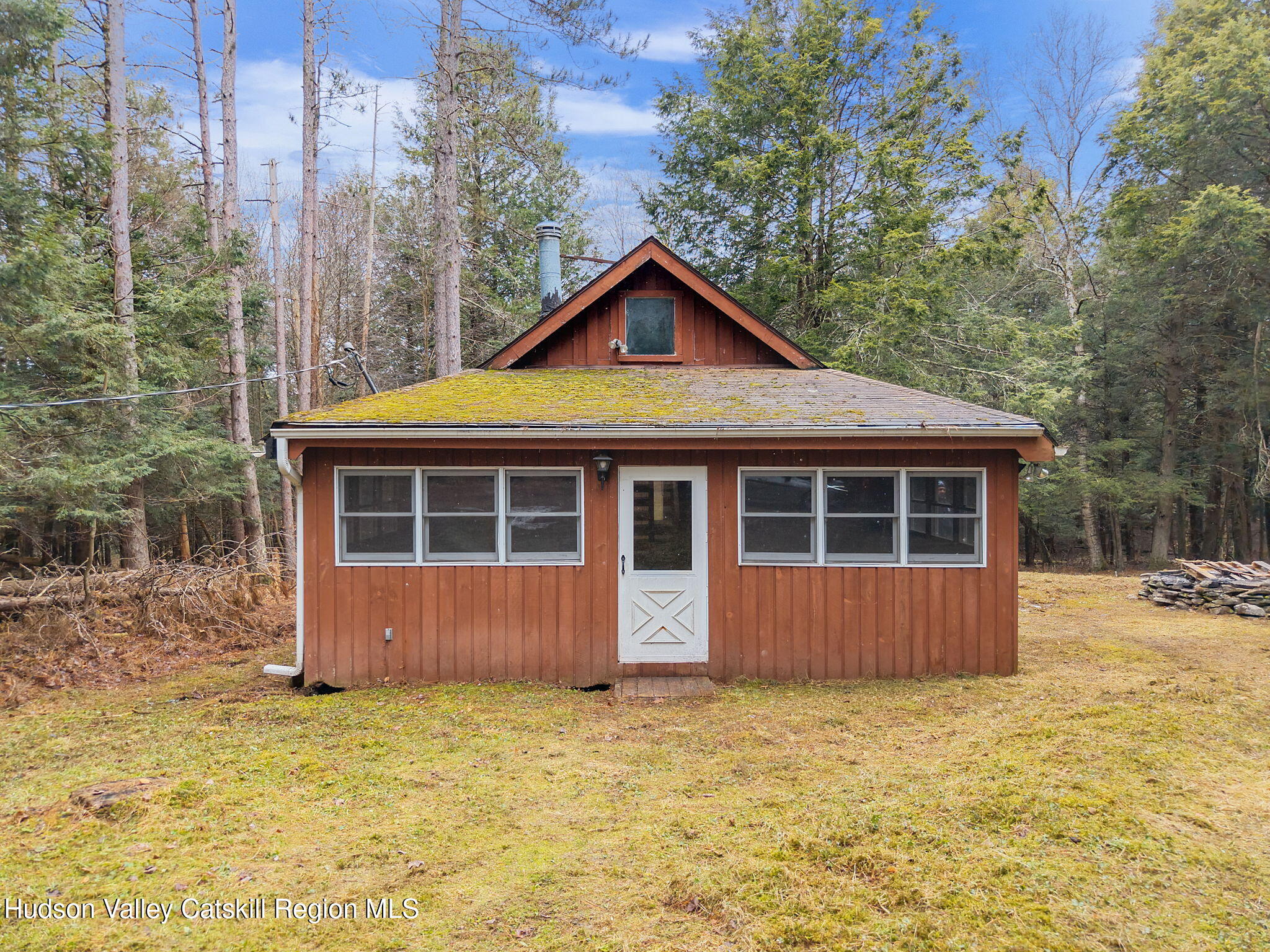 202 Blakesley Road, Unit PRIVATE Gilboa, NY 12076 - Photo 3 of 39 a front view of a house with a yard and garage