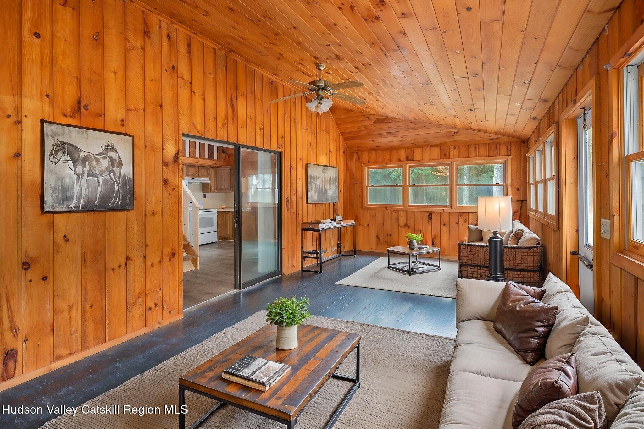 202 Blakesley Road, Unit PRIVATE Gilboa, NY 12076 - Photo 7 of 39 a living room with furniture and a window