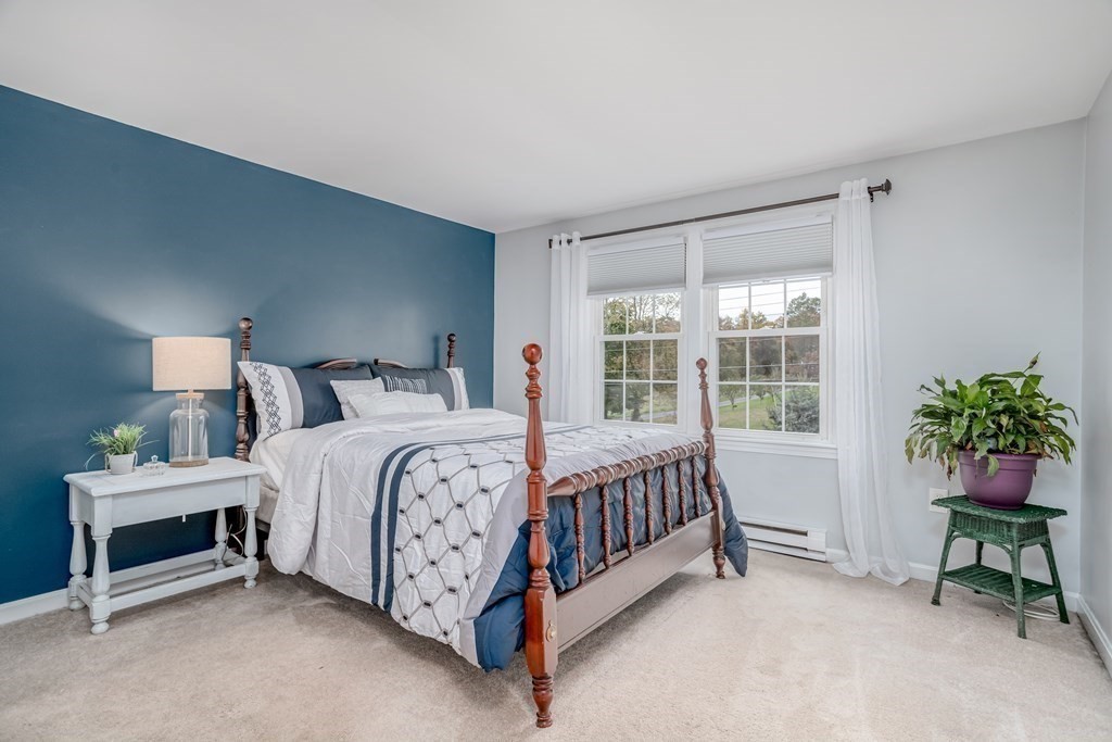67 Bean Porridge Hill Road Westminster, MA 01473 - Photo 11 of 42 a bed sitting in a bedroom next to a window