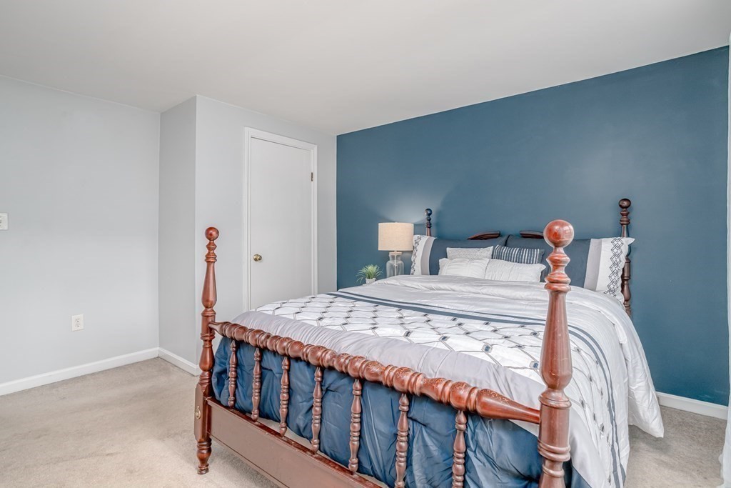 67 Bean Porridge Hill Road Westminster, MA 01473 - Photo 13 of 42 a bedroom with a bed and wooden floor