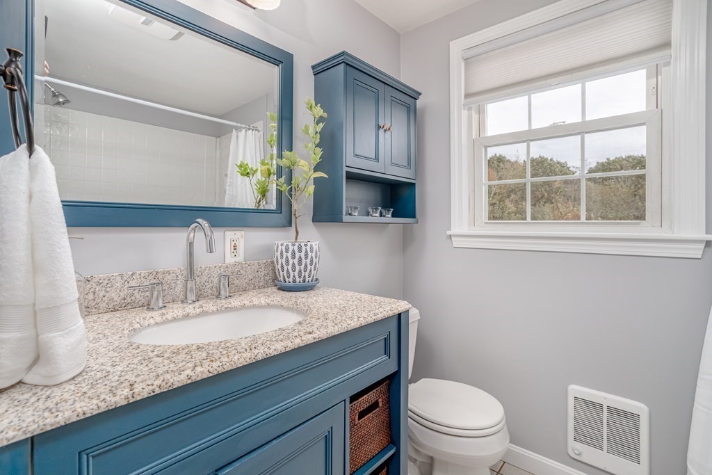 67 Bean Porridge Hill Road Westminster, MA 01473 - Photo 16 of 42 a bathroom with a granite countertop toilet sink and mirror