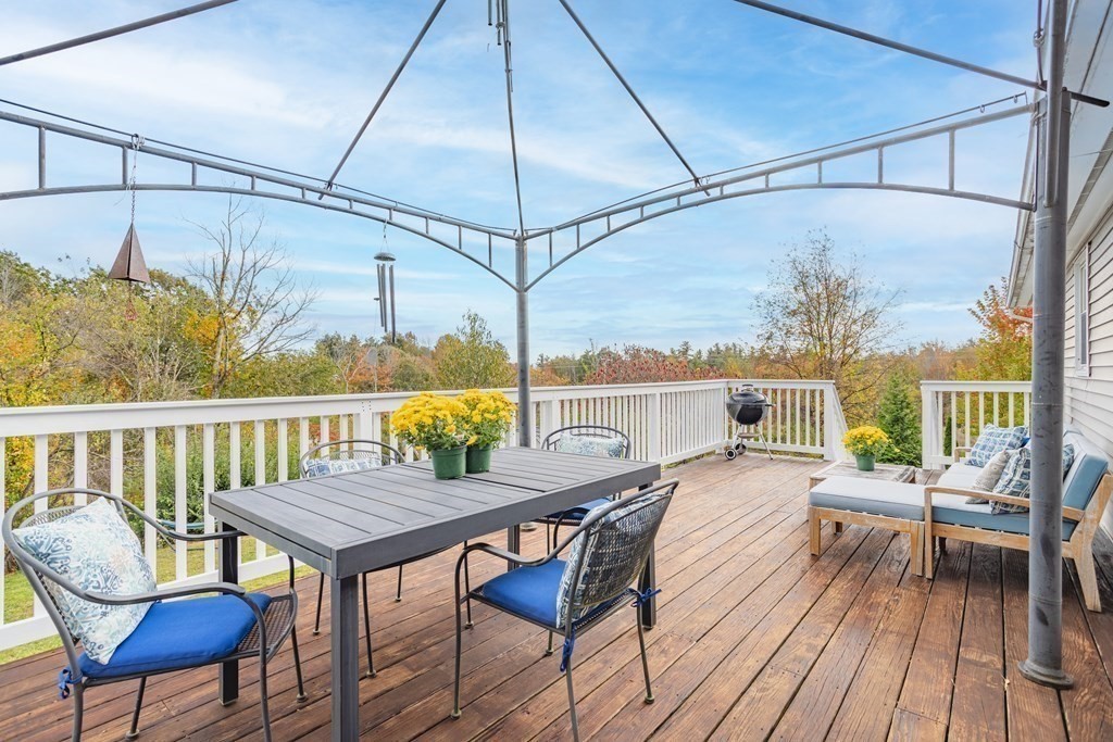 67 Bean Porridge Hill Road Westminster, MA 01473 - Photo 35 of 42 a view of a balcony with furniture and wooden floor