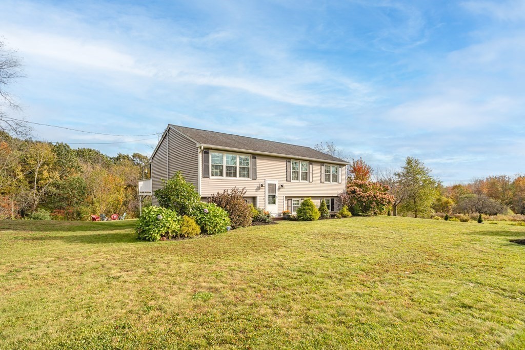 67 Bean Porridge Hill Road Westminster, MA 01473 - Photo 42 of 42 a view of house with an outdoor space and seating area