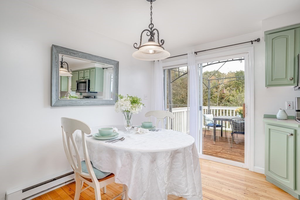 67 Bean Porridge Hill Road Westminster, MA 01473 - Photo 10 of 42 a dining room with furniture a chandelier and wooden floor