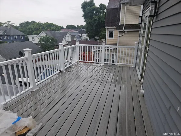 a view of deck with wooden floor and fence