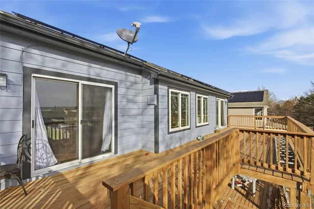a view of balcony with wooden floor and outdoor space