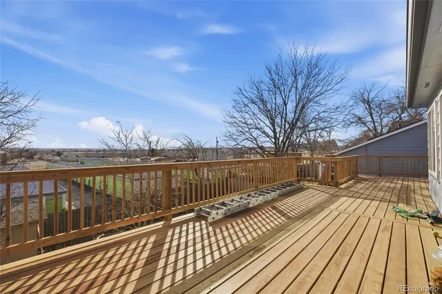 a view of a balcony with furniture