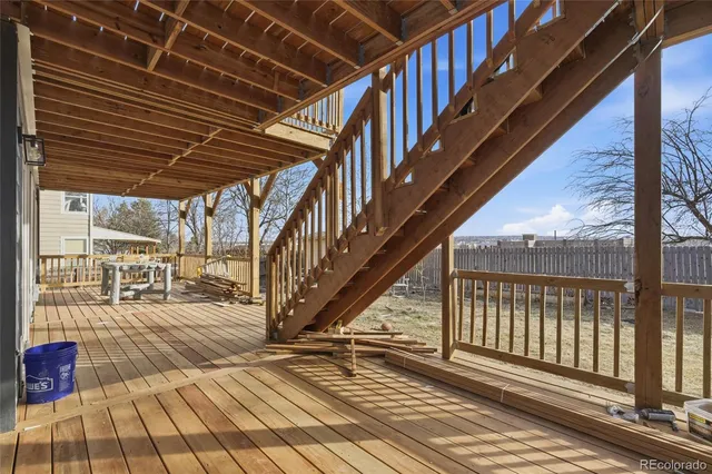 a view of a house with snow on the road