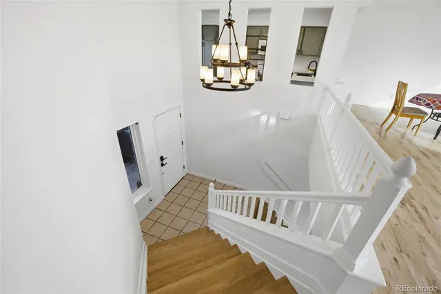 a view of a hallway with stairs
