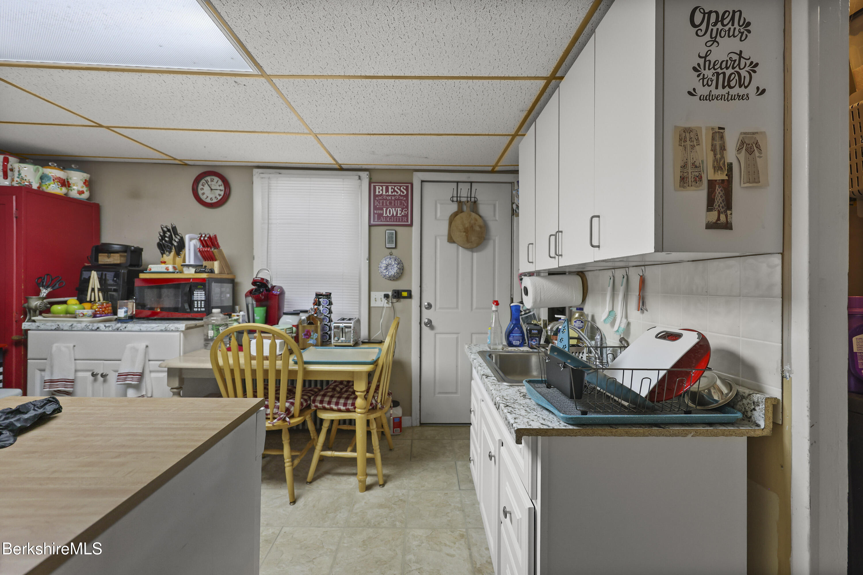 585-a & B State Road North Adams, MA 01247 - Photo 8 of 17 a view of a dining room with furniture and a kitchen