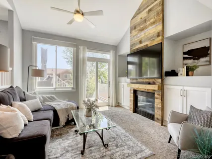 a living room with furniture and a rug