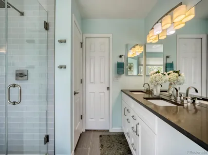a bath tub sitting in a bathroom next to a window