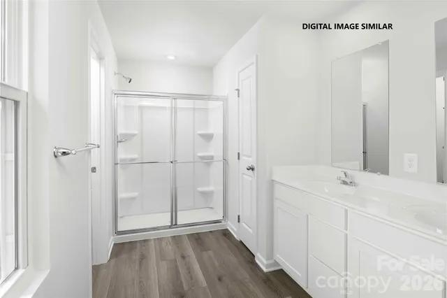 a bathroom with a sink and shower