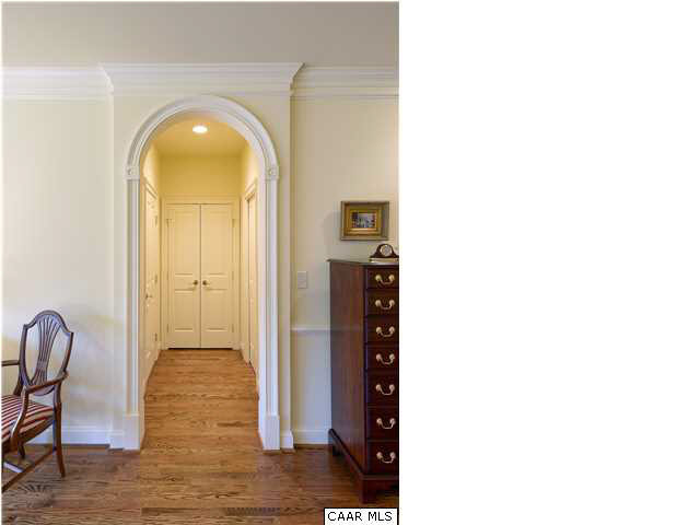 3333 Darby Road, Unit T271 Keswick, VA 22947 - Photo 14 of 32 a view of a hallway with wooden floor
