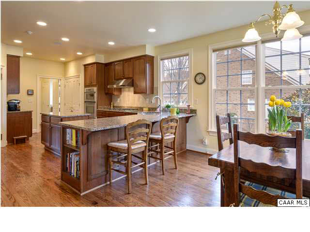 3333 Darby Road, Unit T271 Keswick, VA 22947 - Photo 8 of 32 a living room with stainless steel appliances kitchen island granite countertop furniture and a dining table
