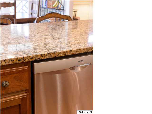 3333 Darby Road, Unit T271 Keswick, VA 22947 - Photo 10 of 32 a bathroom with a granite countertop sink and a mirror