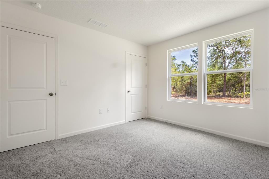 5540 Chestnut Avenue Bunnell, FL 32110 - Photo 12 of 13 an empty room with windows
