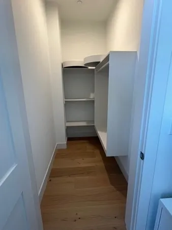 a bathroom with a sink vanity mirror and toilet