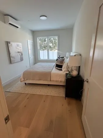 a bedroom with bed and window