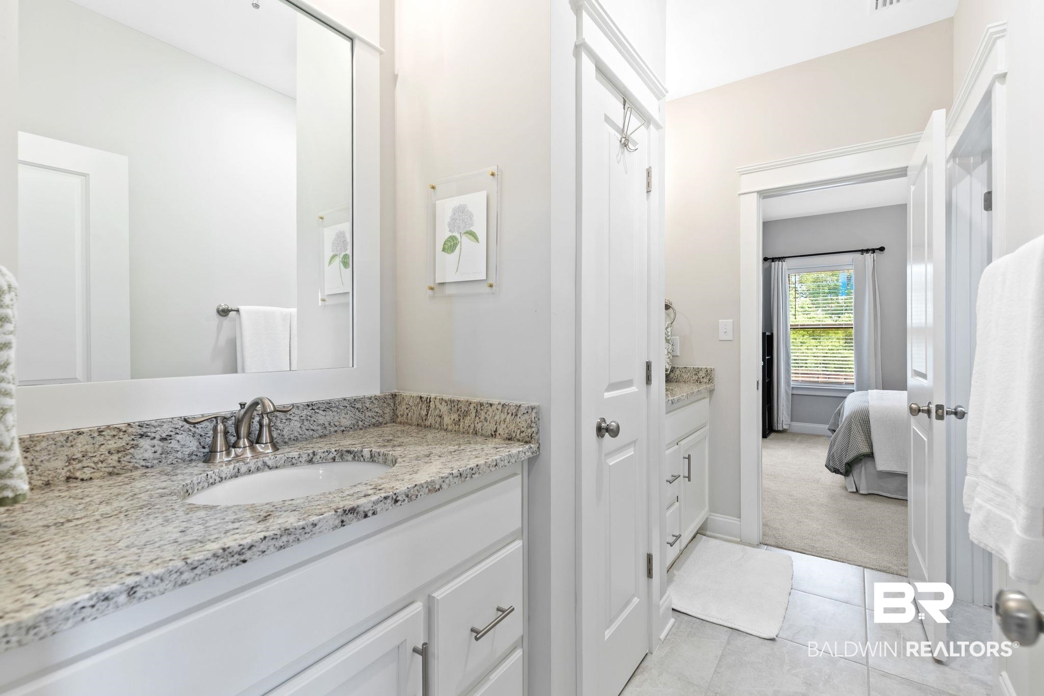 13233 Ibis Boulevard Daphne, AL 36527 - Photo 44 of 100 Bathroom vanity featuring a granite countertop, undermount sink, and brushed nickel faucet