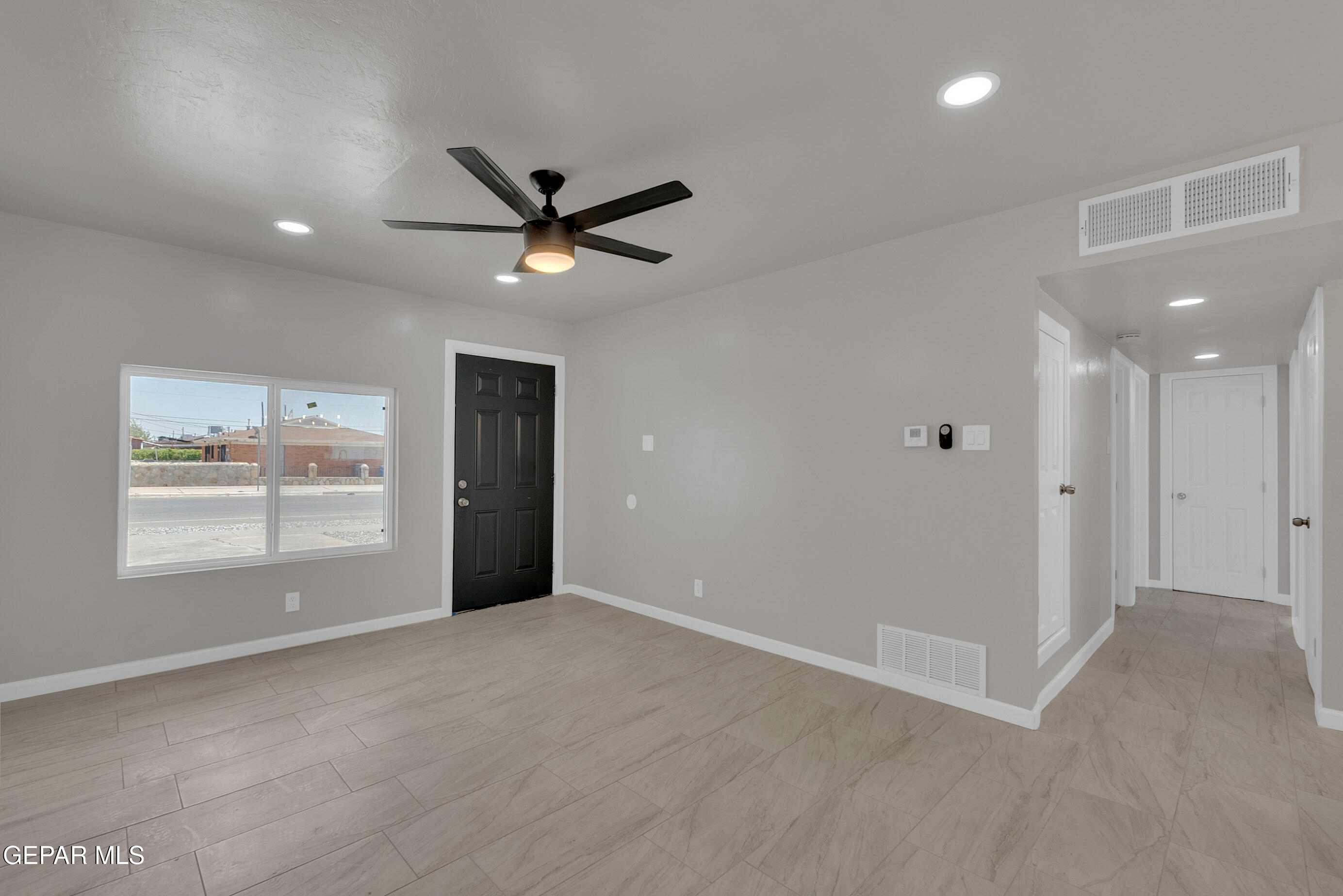 10141 Alcan Street El Paso, TX 79924 - Photo 14 of 49 a view of an empty room with a window