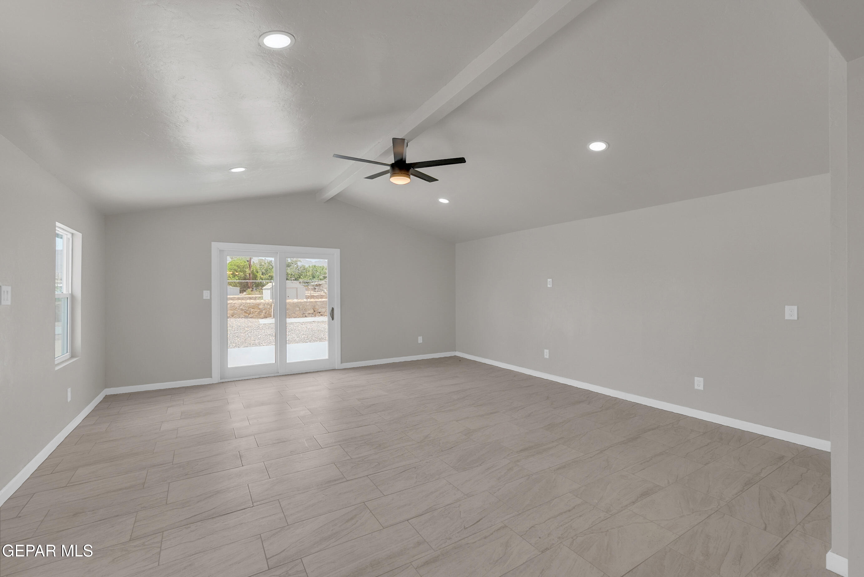 10141 Alcan Street El Paso, TX 79924 - Photo 16 of 49 wooden floor in an empty room with a window