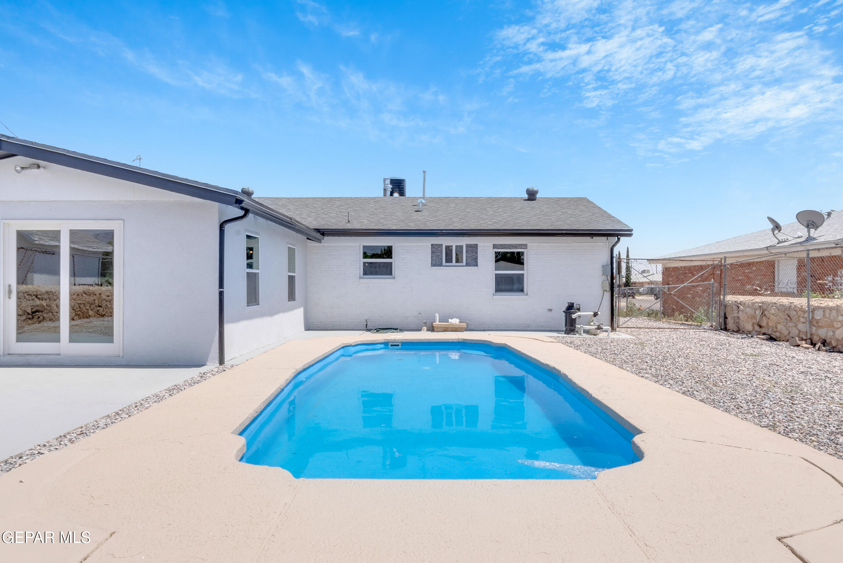 10141 Alcan Street El Paso, TX 79924 - Photo 18 of 49 a front view of a house with swimming pool