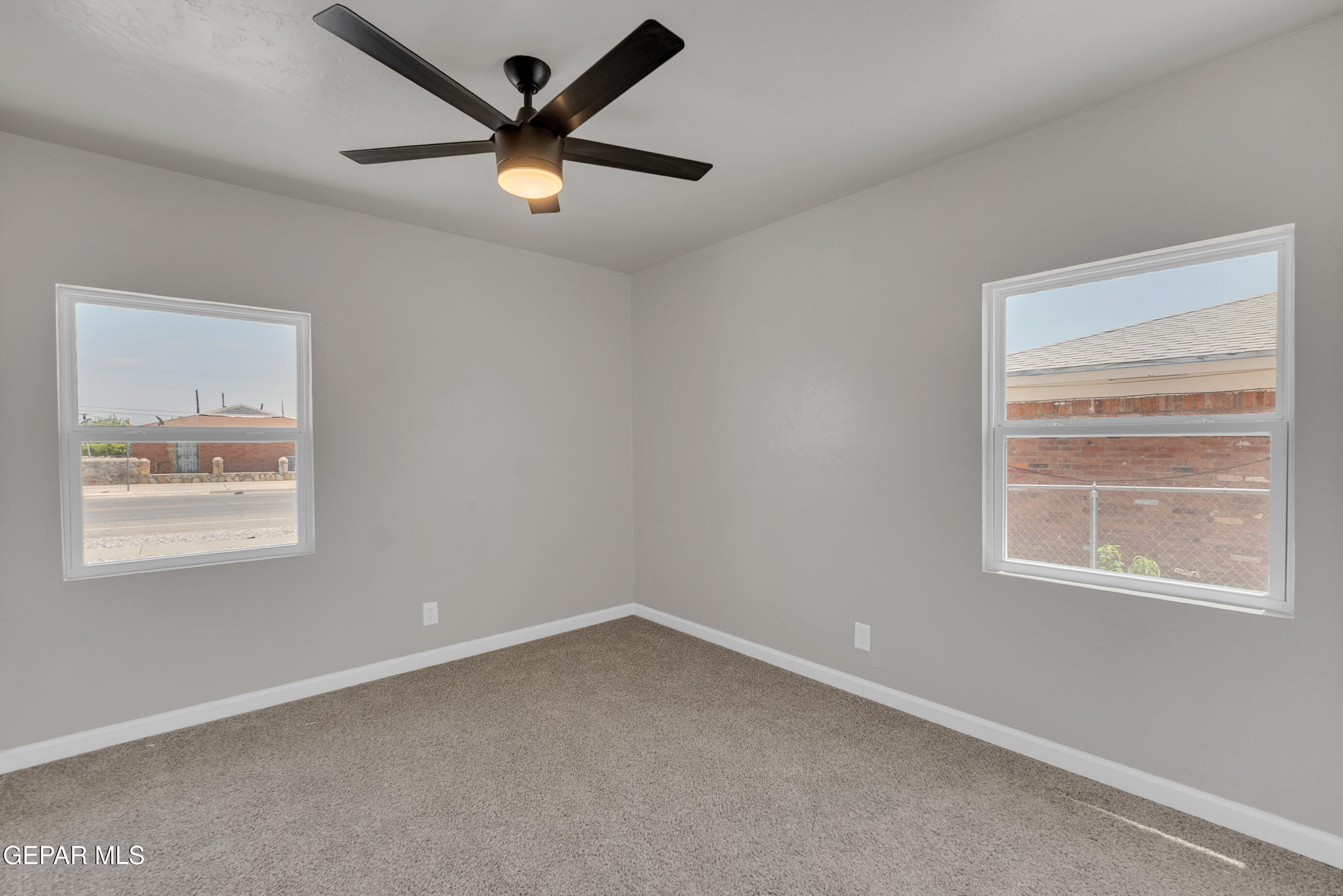 10141 Alcan Street El Paso, TX 79924 - Photo 26 of 49 an empty room with a window and a fan